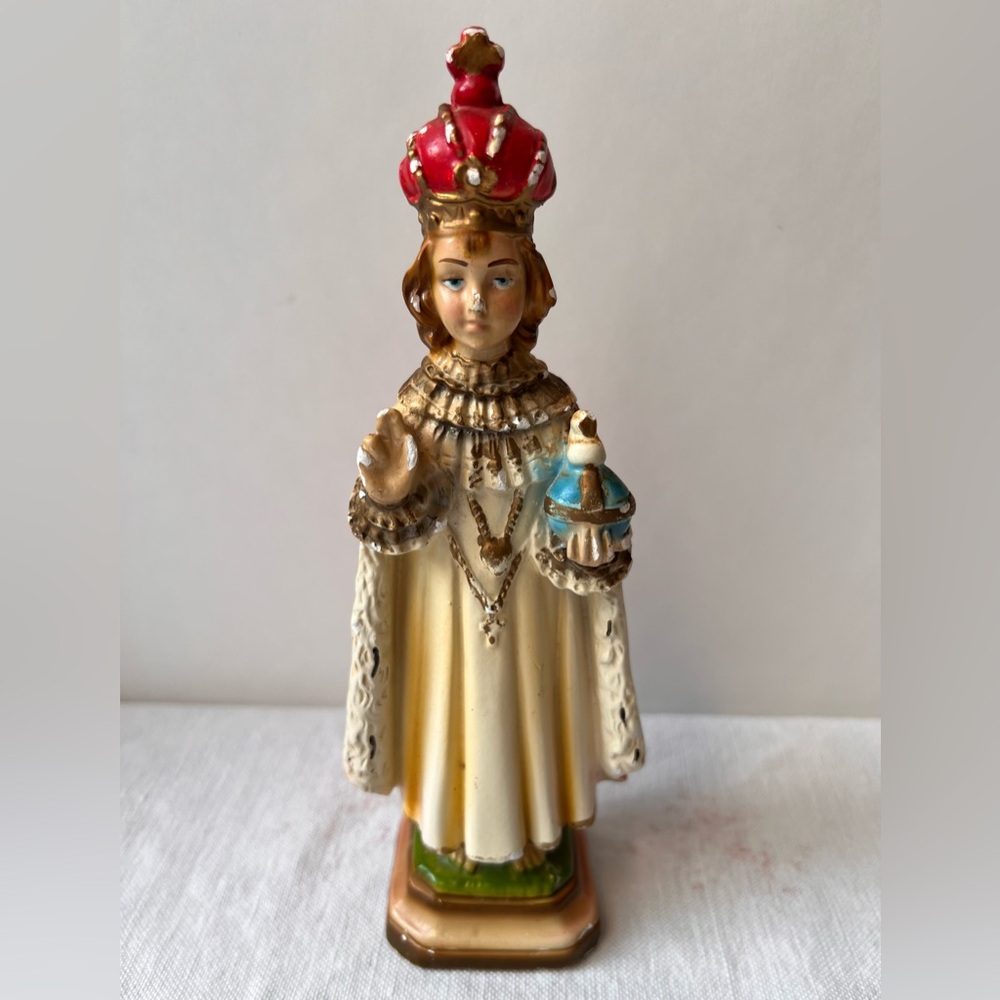 Vintage Religious Figurine with Red and Gold Accents
